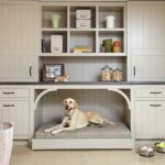 A dog in a pet nook. A big storage cabinet with a built in dog bed. Image courtesy of decoist.com